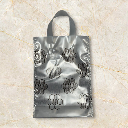 Bolsas de regalo 2×0,5kg (blanca, con panal dorado) - Pack 25 und